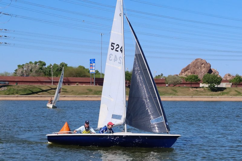 Small Blue Racing Sailboat
